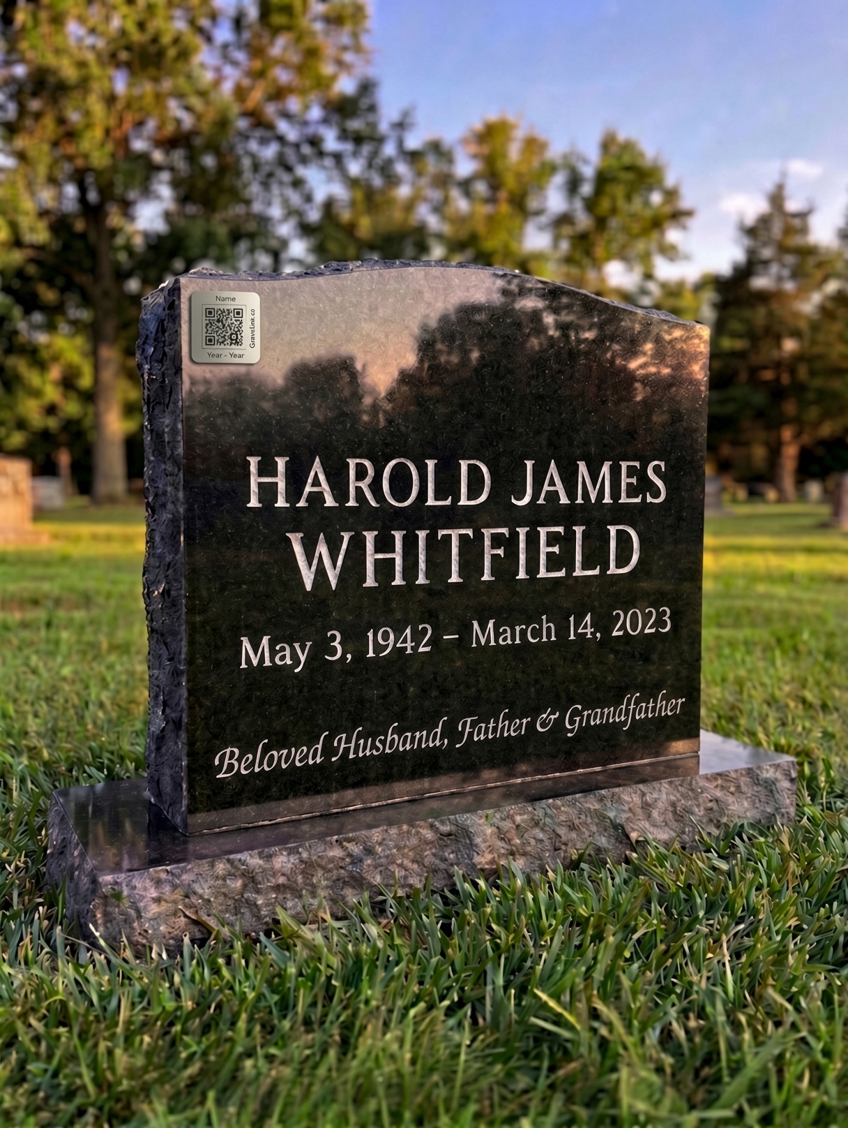 A grade 2 titanium GraveLink QR marker attached to a granite headstone